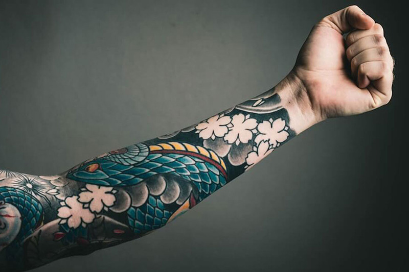An arm with a tattoo sleeve