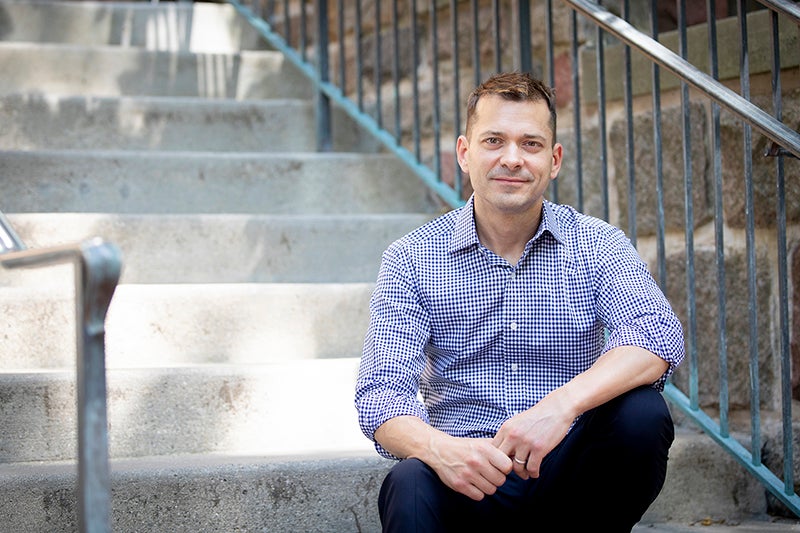 Joe Árvai sitting on steps