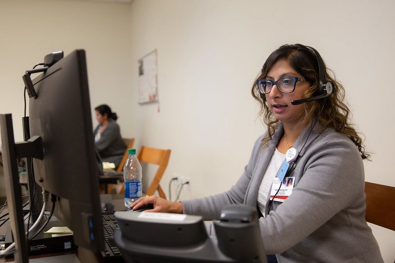 Sirisha Mohan, a family medicine doctor, meets with a patient via video call