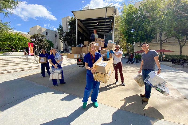 Keck medicine employees receiving PPE equipment