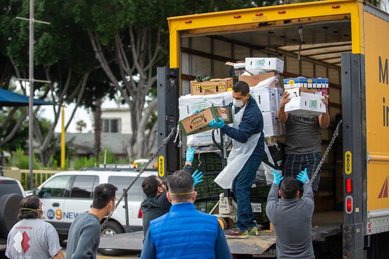 USC employees offloading food from a truck