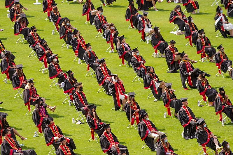 Rows of USC graduates sitting 6 feet apart during the 2021 USC Commencement Ceremonies