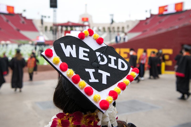 A USC graduate's mortar board with the words "We Did It" designed on it.