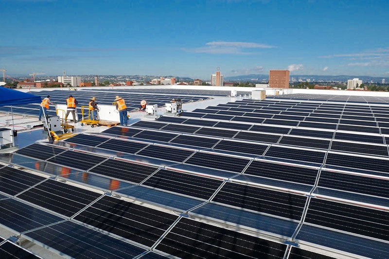 Workers have been making progress with the solar panel installation on the roof of the Galen Center