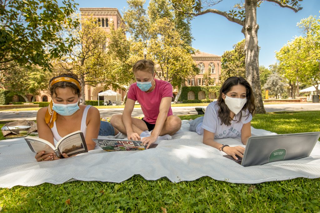 Students in masks enjoying USC's outdoor spaces during quarantine