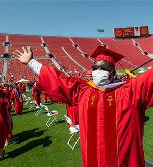 USC graduate student inside LA Coliseum rejoicing