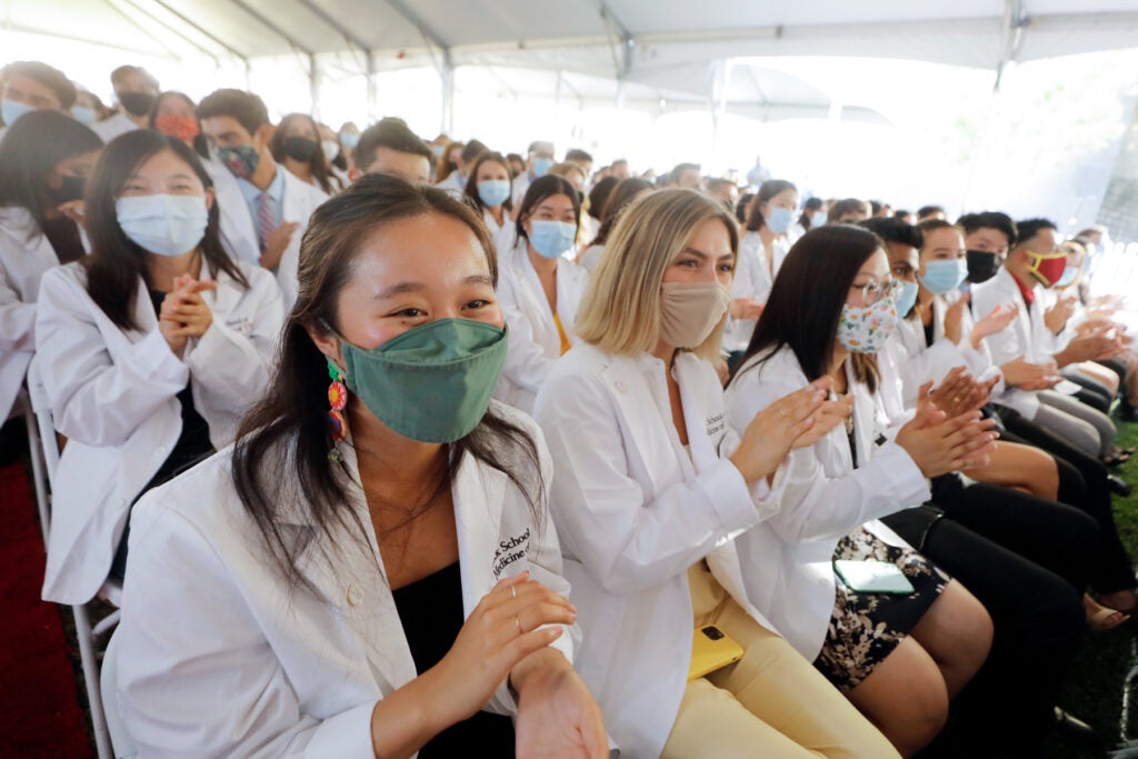 First-year MD candidates cheer during the White Coat ceremony on the Health Sciences Campus at the Keck School
