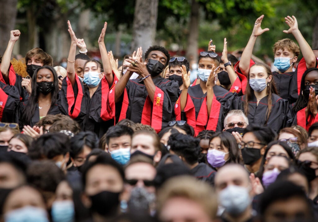 A group of incoming USC freshmen celebrate during convocation