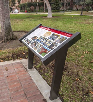A plaque on USC campus commemorating the Presidential Medallion honoring staff and faculty.