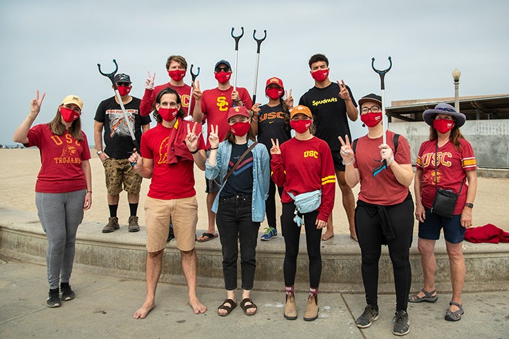 USC alumni pose for a group picture after a day of volunteering