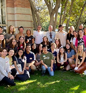 A group of USC students with faculty take a group picture