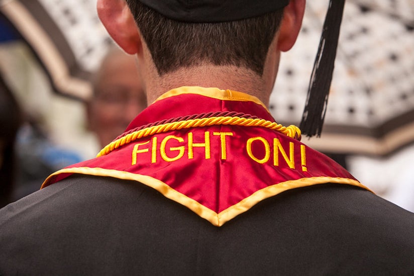 A graduation sash with Fight On embroidered on it