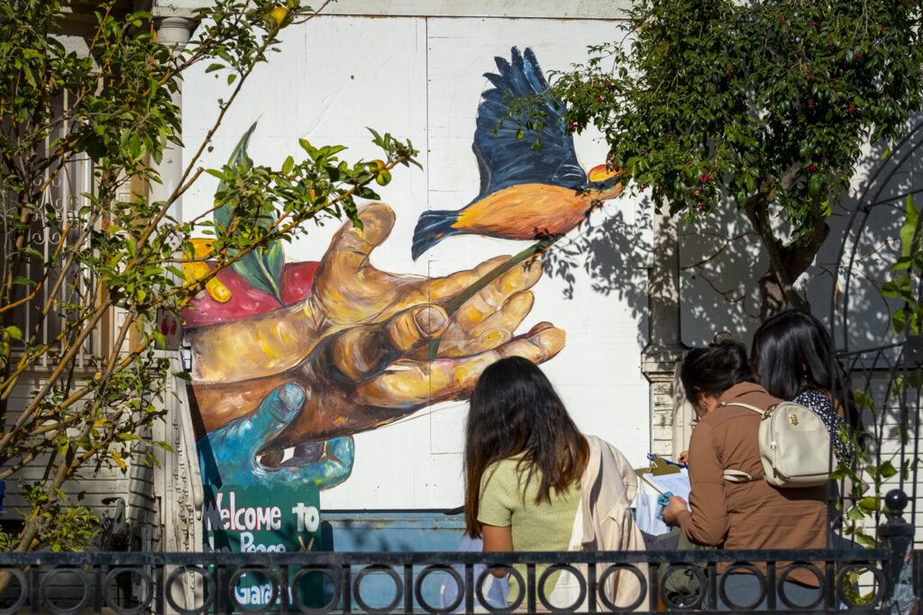 Visitors to the peace garden are treated to the partially completed mural by USC student Daniella Leon