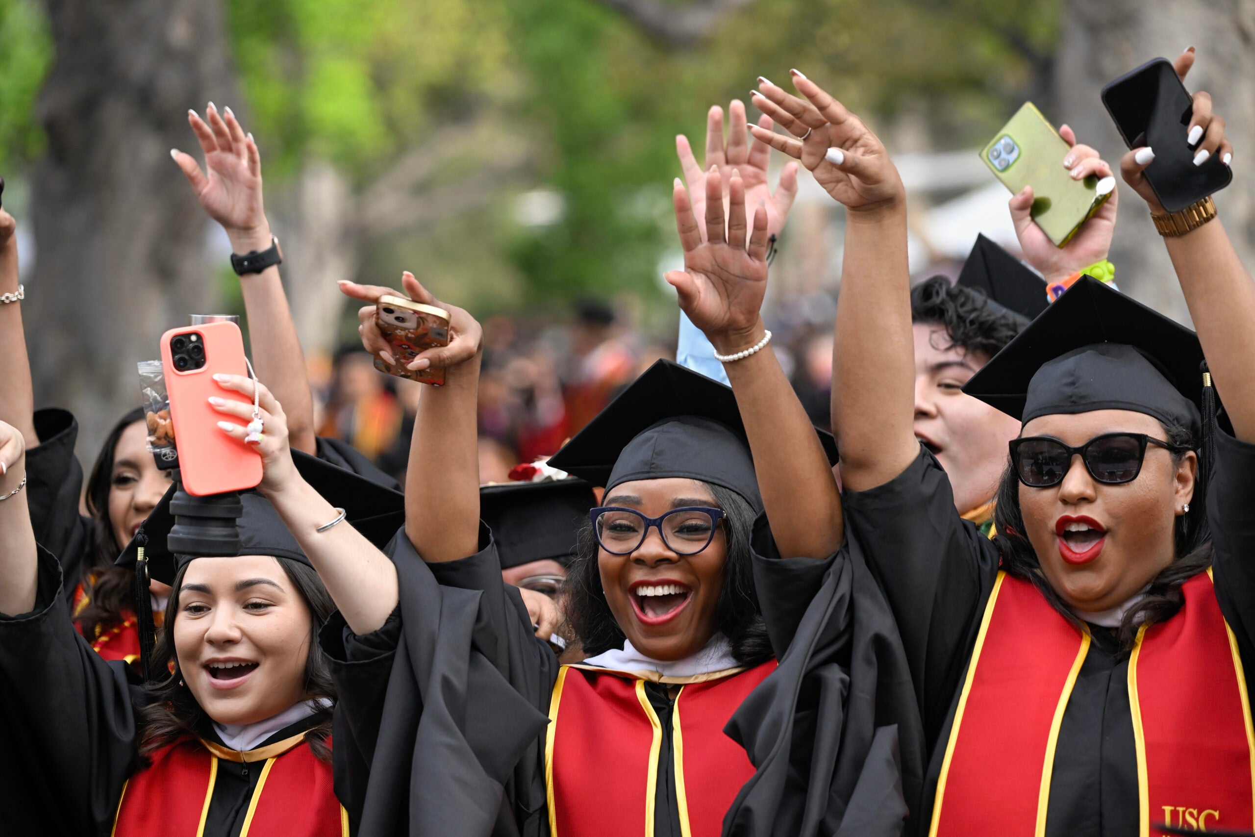 Graduates celebrate during the 140th commencement ceremony at the University of Southern California, May 12, 2023. (Photo/Gus Ruelas)
