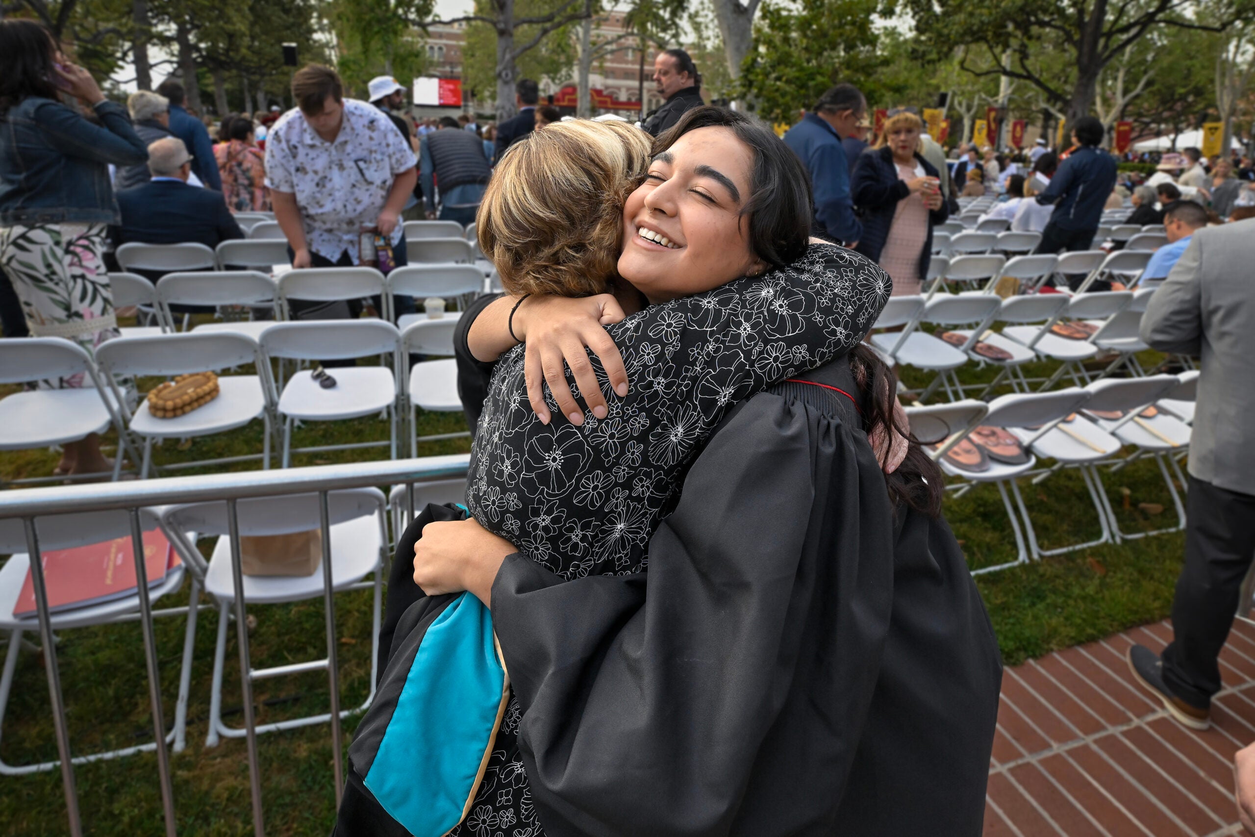 Kelsea Nanan hugs aunt Susie Riopel before the start of the 140th commencement ceremony at the University of Southern California, May 12, 2023. (Photo/Gus Ruelas)