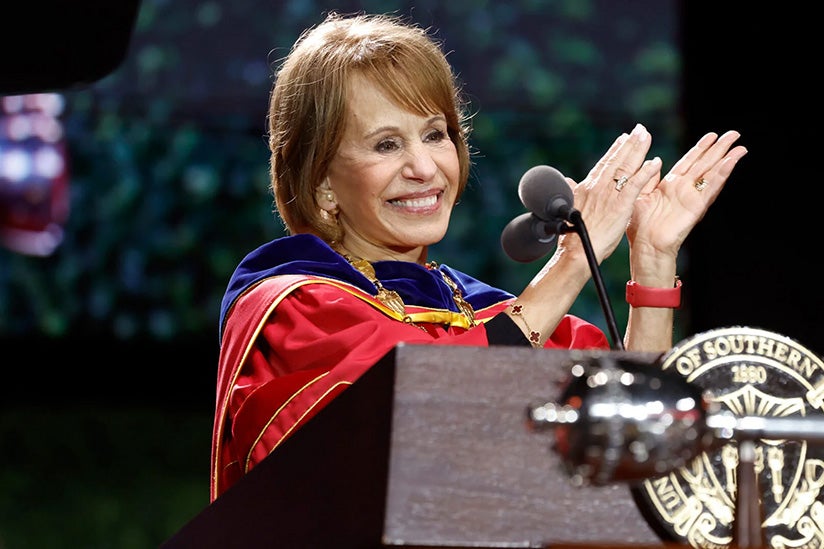 President Folt at a podium