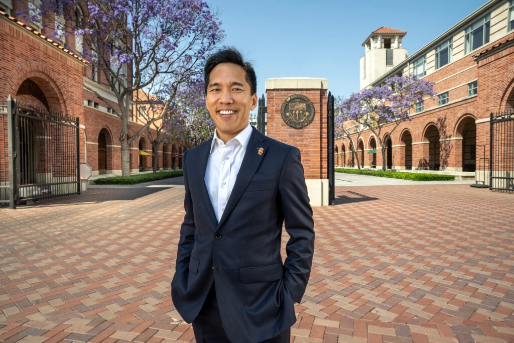 Beong-Soo Kim in front of the USC seal