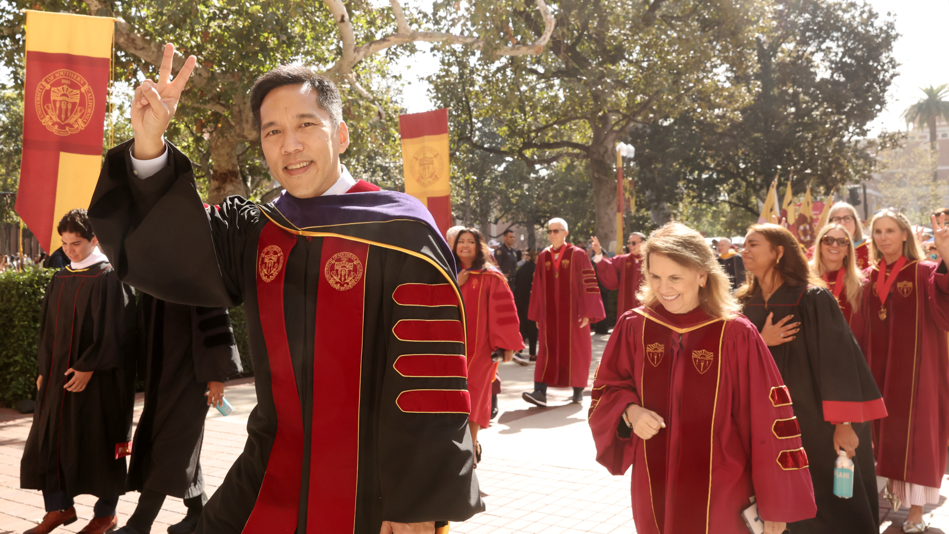 USC President Beong Soo-Kim gestures a 